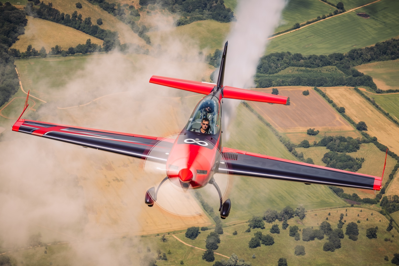 The Extra 300 approaching the camera with smoke on