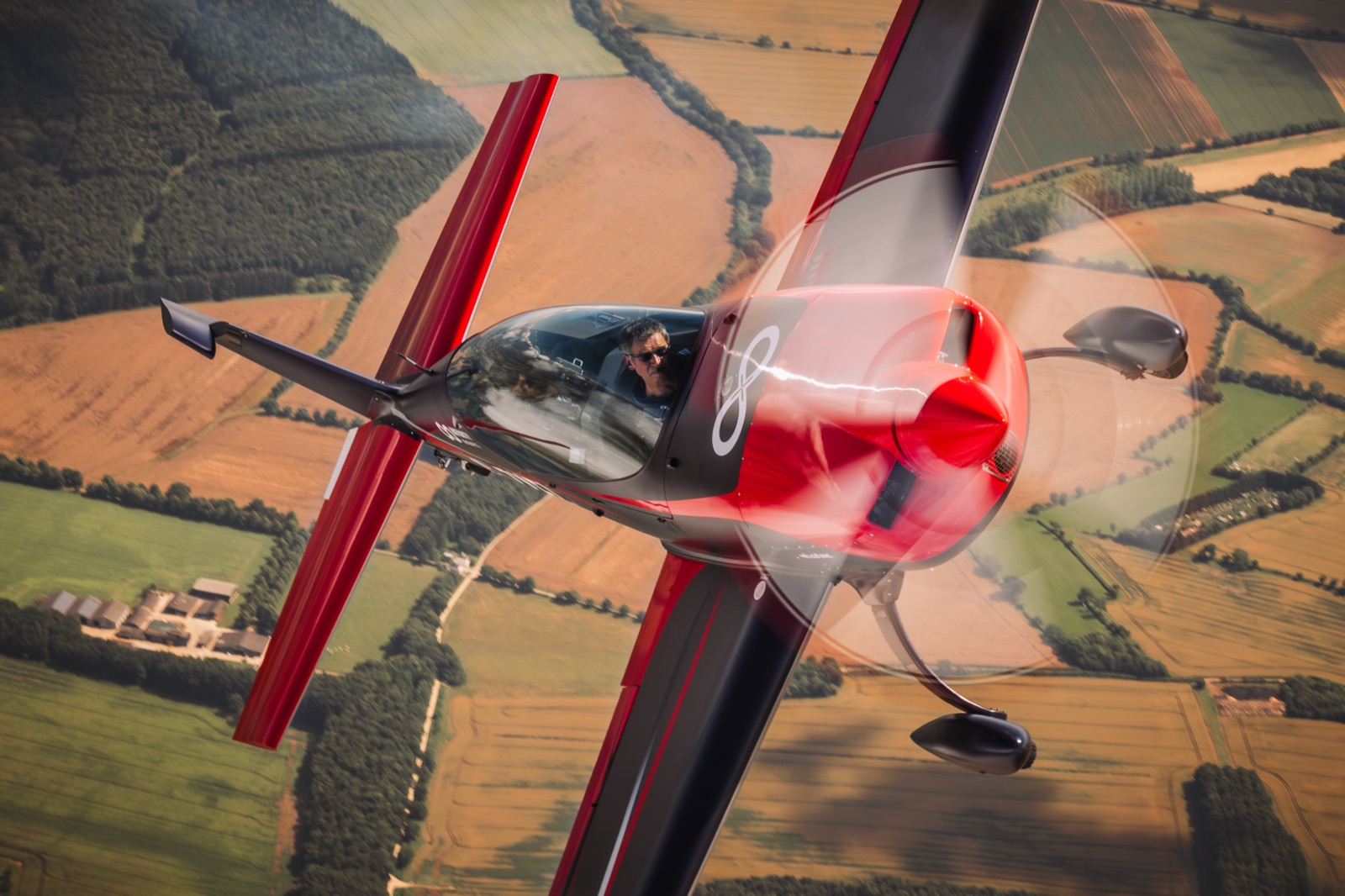 The Extra 300 banking over golden Bedfordshire fields