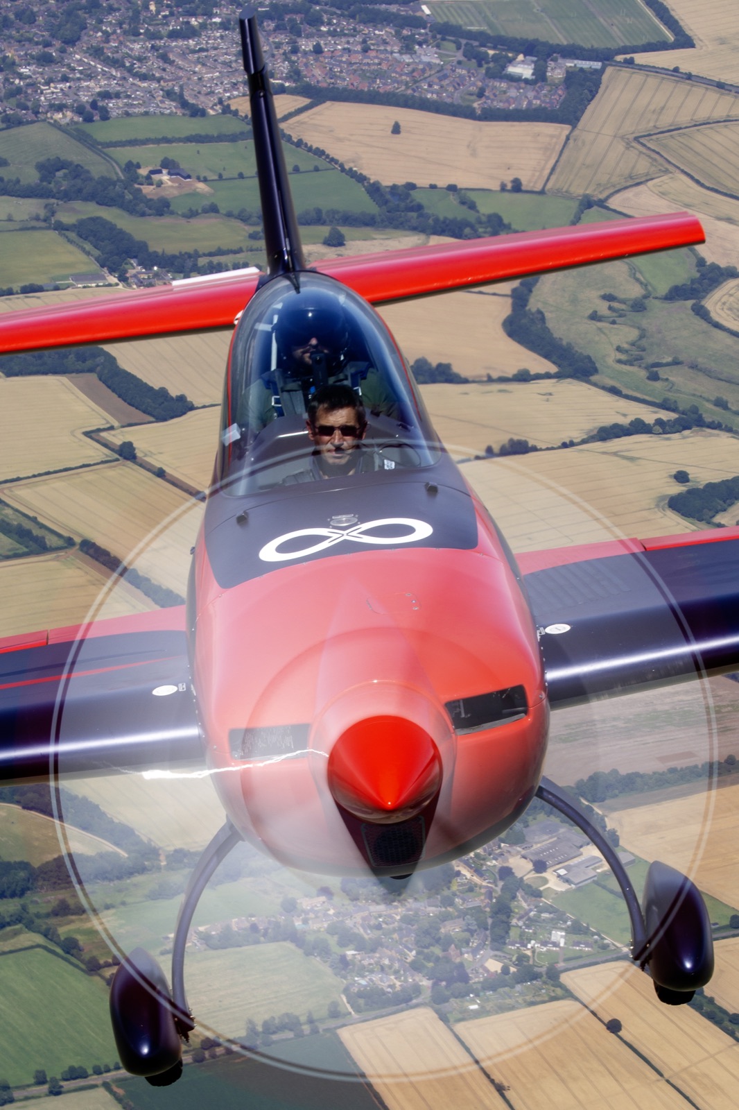 Head-on view of the Extra 300 with the propeller disc blurred