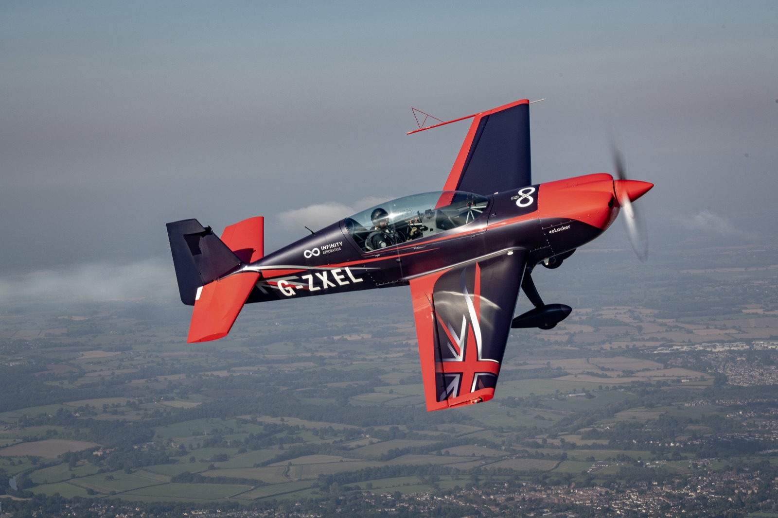 The Extra 300 banking away to show the Union Jack on its underside