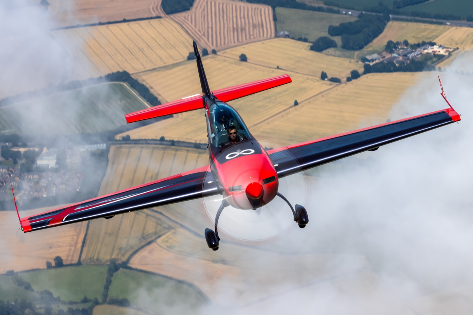 The Extra 300 banking out of its own smoke