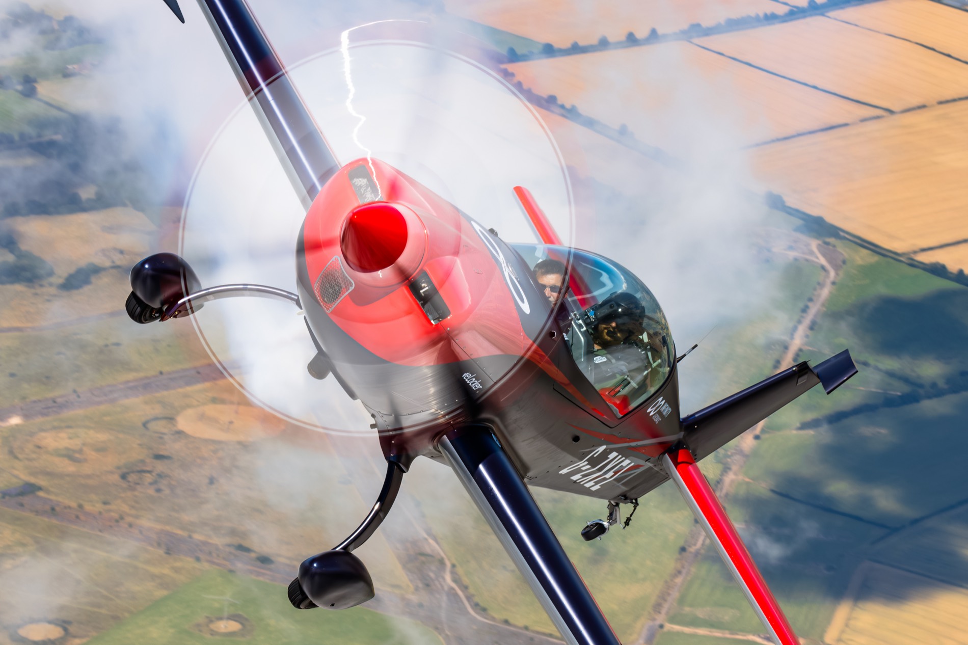 Extra 300 inverted on an aerobatic flight experience